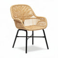 Woven rattan chair with black metal legs for indoor and outdoor use